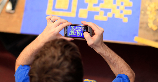 man scanning qr code