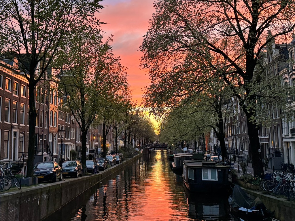 A gorgeous pink sunset over the Bloemgracht canal in Amsterdam